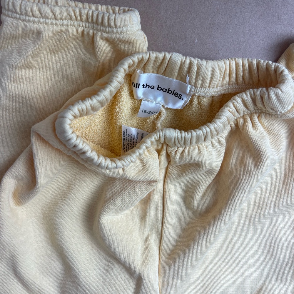 All The Babies brand sweatpants “organic cozies” in butter yellow size 18-24m